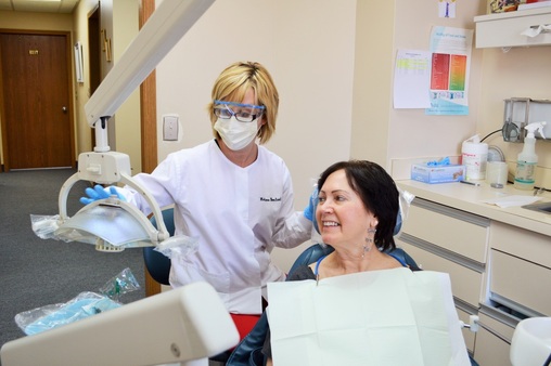 Dental Hygienist Melissa Beecherl and patient